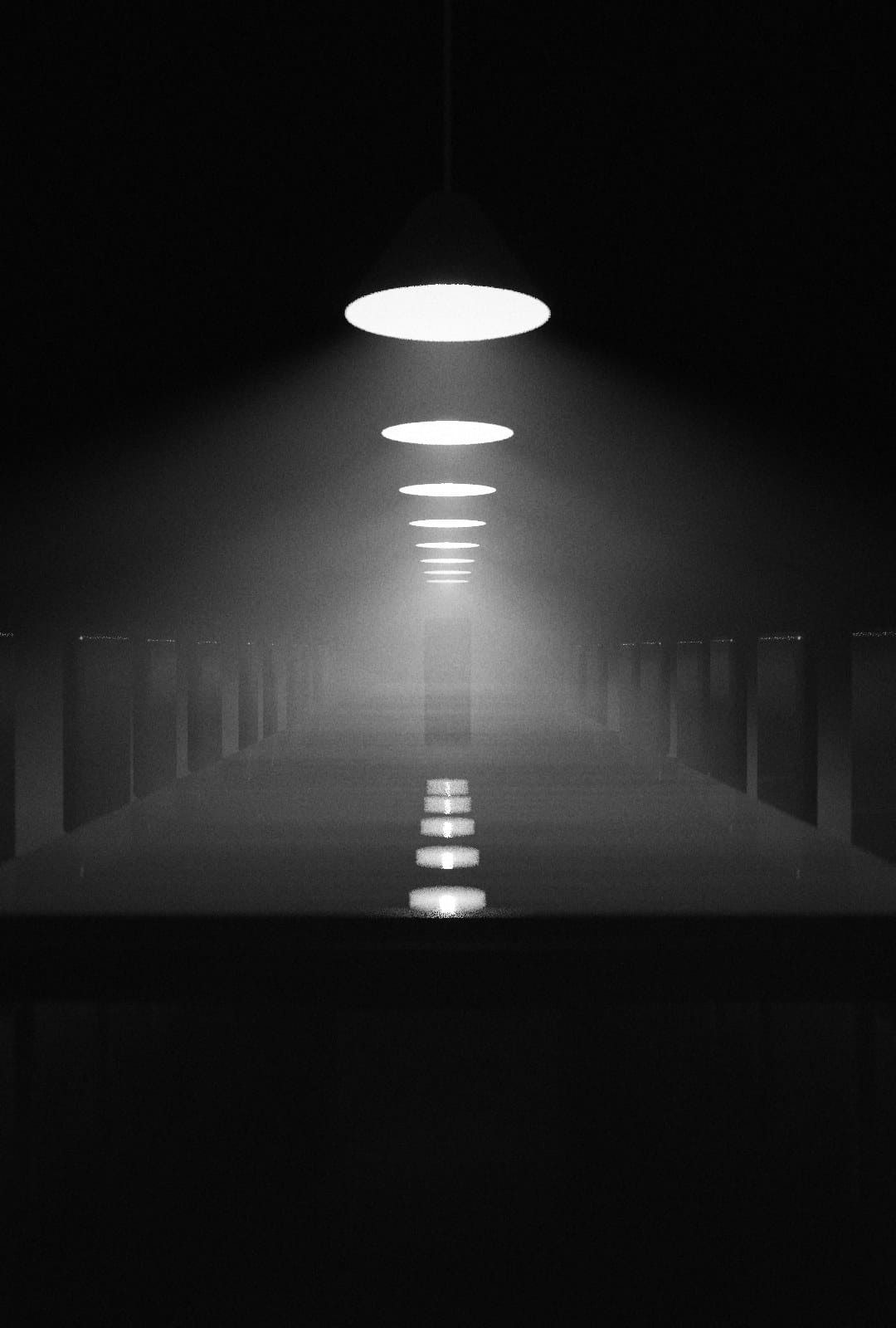 A long table under a row of pendant lamps. Every chair is empty.